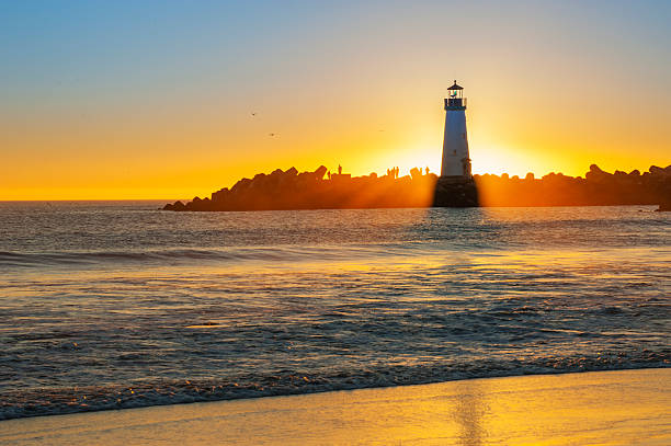 istock Light house with sunset in the background 493635031