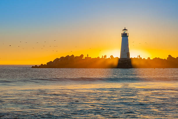 istock Light house with sunset in the background 493635035