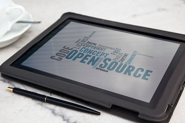 tablet with open source software word cloud stock photo