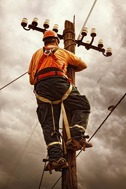 istock Electrician doing power line maintenance 493637161