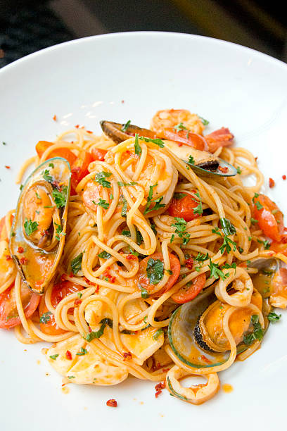 istock spaghetti with shrimp and mussel 493637511