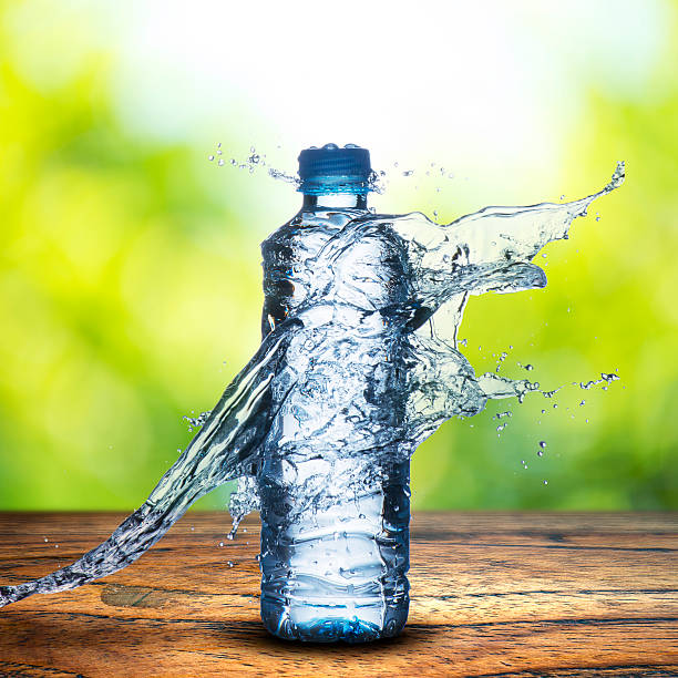 water bottle on wood table stock photo