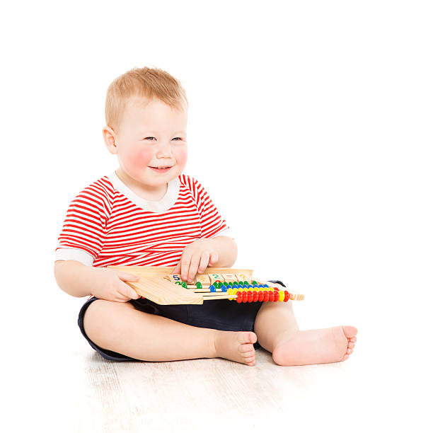 istock Boy child happy with abacus, smart little kid study lesson 493638821