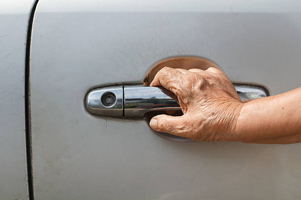 istock senior woman open a car door 493639747