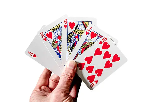 Photo of Royal flush poker hand cards isolated on white