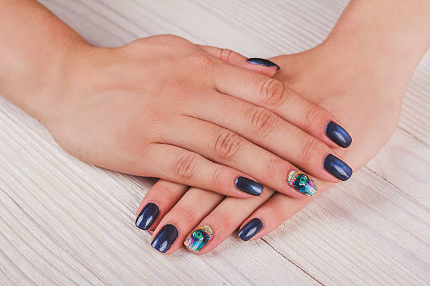 istock Dark blue nail art with print eye 493649016