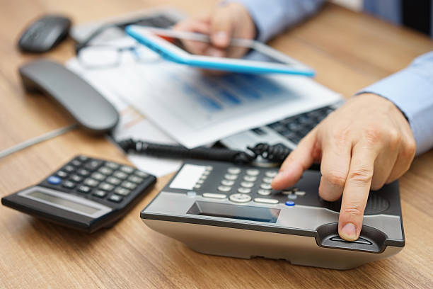 istock business man hanging up the phone while working on tablet 493650120