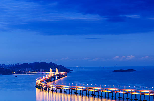 istock Xing Hai bay bridge bird view at dusk. 493651062