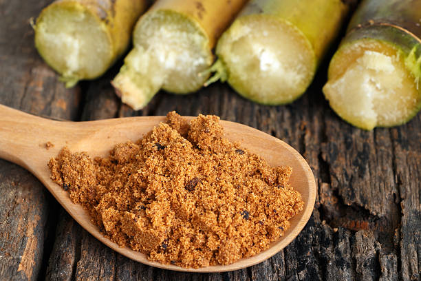 istock Brown sugar close-up on wooden spoon 493651310