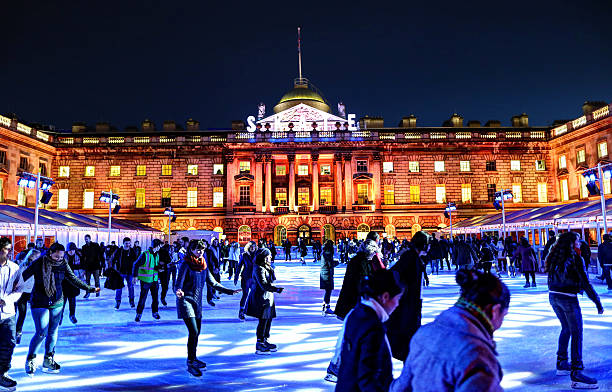 Ice Skating in Somerset House in the evening London, United Kingdom - November 22, 2012: People skating on a crowded ice skating rink in Somerset House in the evening. university of london photos stock pictures, royalty-free photos & images
