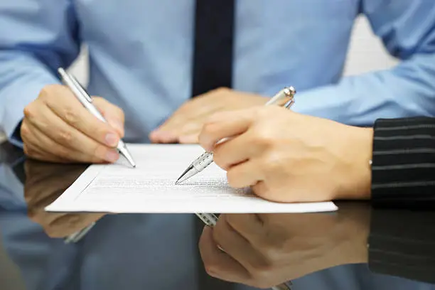 Photo of business team in meeting is working together on financial document