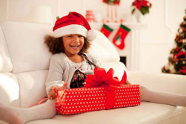 istock Little girl with Christmas present 493653000