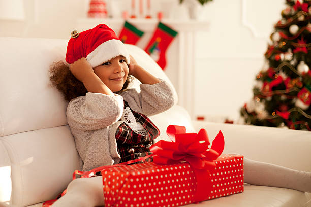istock Little girl with Christmas present 493653052