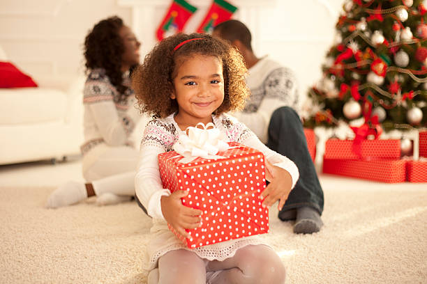 istock Little girl with Christmas present 493653710