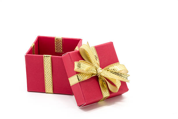 istock christmas gift box with a gold ribbon bow 493653822