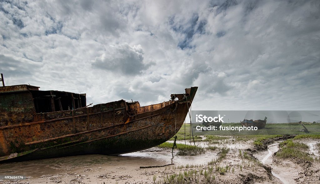 Abandoned Fishing Vessel 2 Abandoned rotting hulks, the remainder of the Fleetwood fishing fleet, lying on the mud flats of the River Wyre in the United Kingdom 2015 Stock Photo