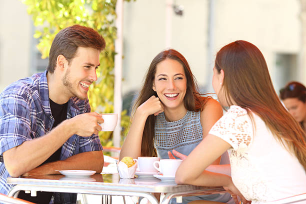istock Friends talking in a coffee shop terrace 493655392