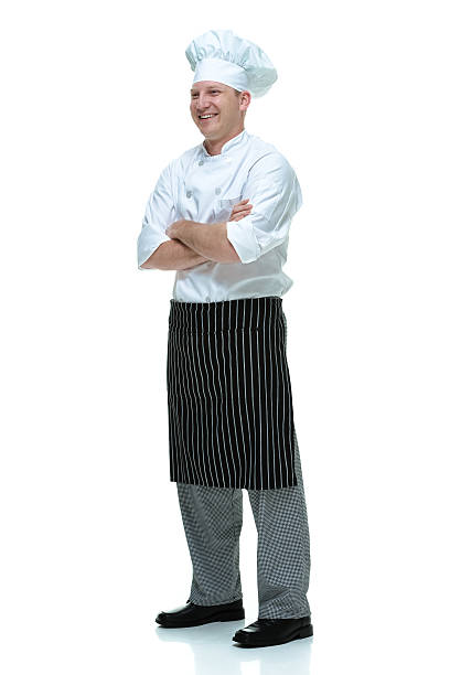 istock Smiling chef standing with arms crossed 493655782