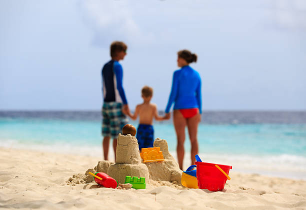 istock sand castle on tropical beach, family vacation 493656626