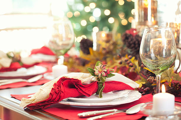 istock Elegant Christmas Holiday Dining in front of Christmas Tree 493657792