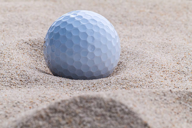 istock Close up golf ball in sand bunker . 493659456