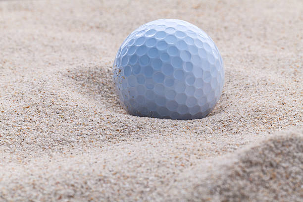 istock Close up golf ball in sand bunker . 493659546