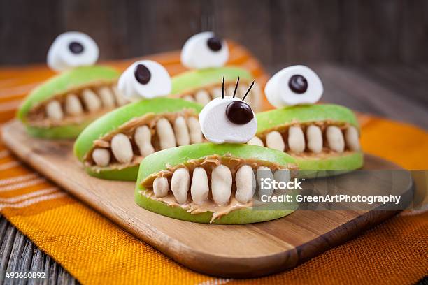 Spooky Halloween Edible Apple Monsters Healthy Natural Dessert Horror Party Stock Photo - Download Image Now