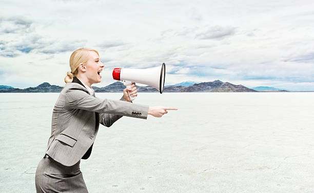 istock Businesswoman shouting and pointing 493660934