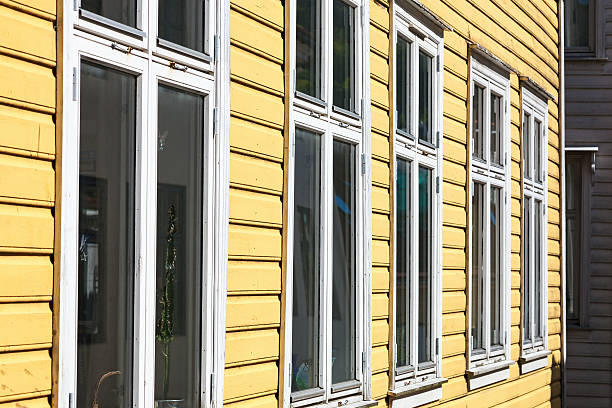 istock Windows in row on old wooden house 493661454