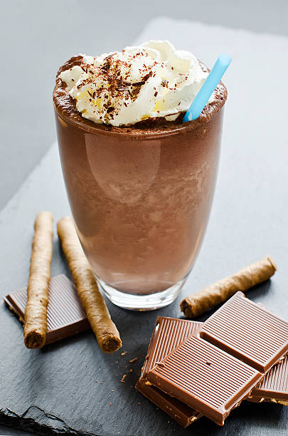 istock Chocolate smoothie in glass with whipped cream for dessert 493684932