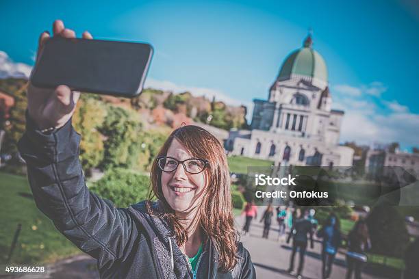 Woman Doing Selfie In Front Of Saint Josephs Oratory Montreal Stock Photo - Download Image Now