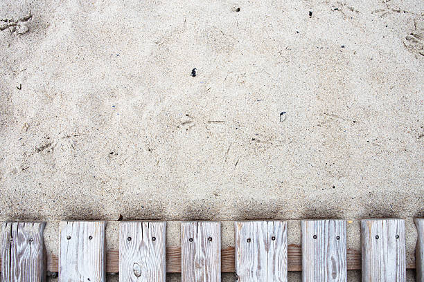Old wooden bridge with sand