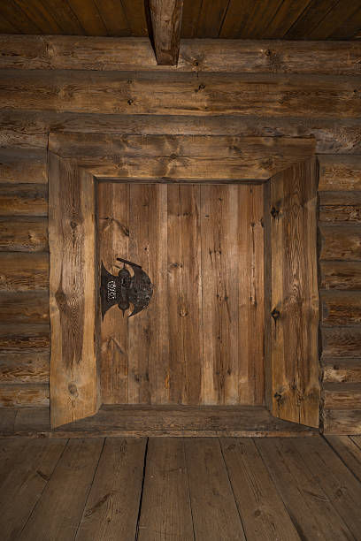 istock Wooden old door with lock and wall. Background 493688746