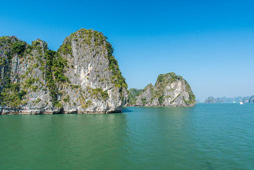 A breathtaking image of Ao Phang Nga National Park, capturing the dramatic limestone cliffs and emerald-green waters. This iconic landscape, dotted with lush islands and tranquil coves, epitomizes the serene beauty and geological wonder of this renowned area in Thailand.