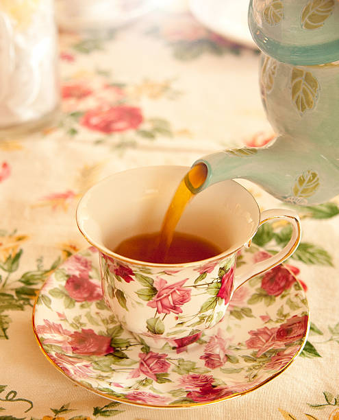 istock Pouring tea into a floral tea cup 493692320