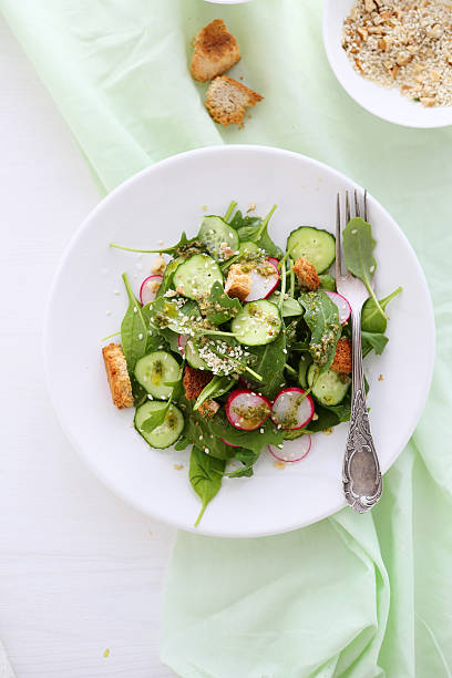 istock salad with cucumber and croutons 493693204