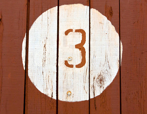 istock Number three on wooden painted wall. 493693318