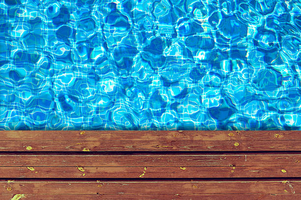 istock Swimming pool and wooden deck for backgrounds 493693696