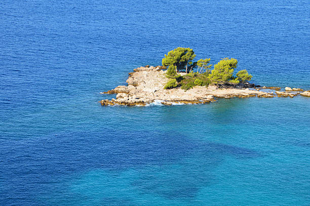 istock Small Island in Blue Sea 493694154