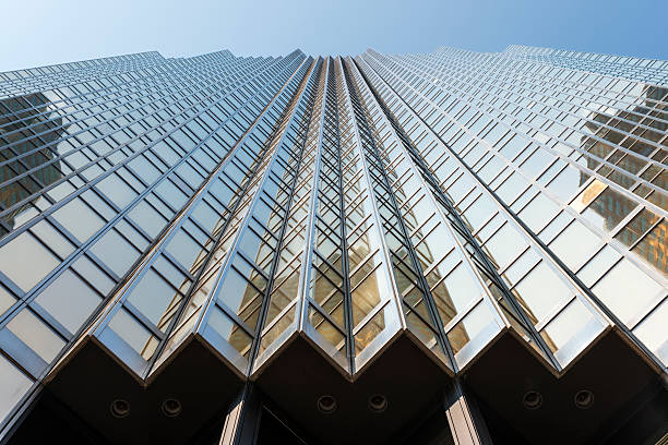 Low-angle view of a modern golden building in Toronto's financial district, Canada.