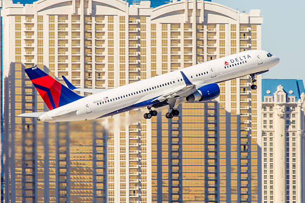 Boeing 757 Delta Airlines takes off from McCarran Airport Las Vegas, NV, USA - November 7, 2014: Boeing 757 Delta Airlines takes off from McCarran Airport located in Las Vegas, NV on November 7, 2014. Delta is the oldest airline still operating in the United States. boeing 757 stock pictures, royalty-free photos & images