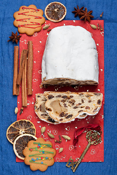 istock Christmas Stollen, spices and Christmas decorations. Vertical,  top view 493696436