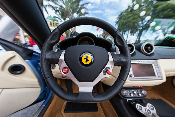 Naples, FL, United States - December 20, 2009: Vantage point behind the wheel of a beautiful ferrari during a exotic car show in Naples, Florida.