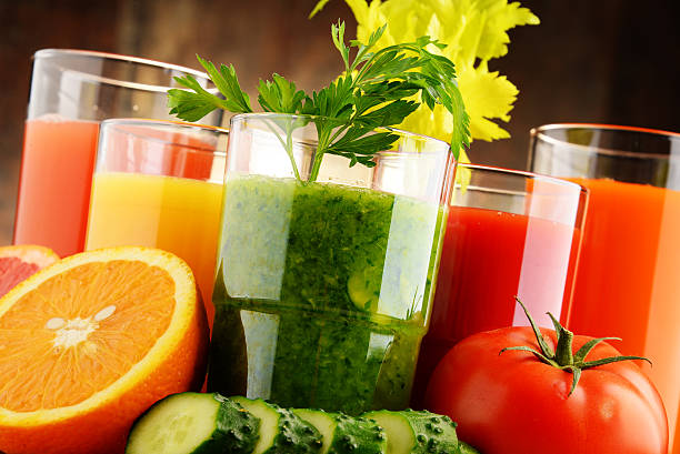 istock Glasses with fresh organic vegetable and fruit juices 493698126
