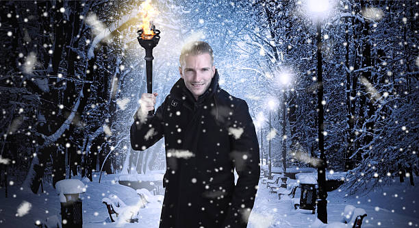istock Christmas time - man walking during a snowy night 493698224