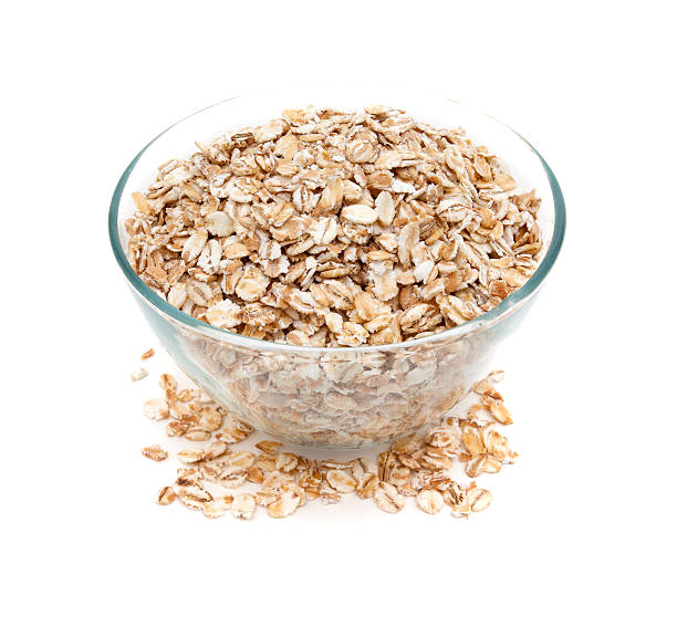 istock oat flakes in a glass bowl isolated on white 493698686