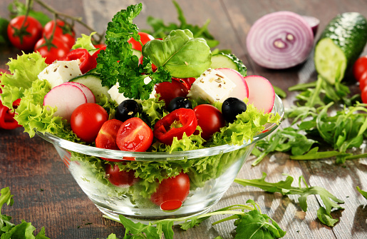 Vegetable salad bowl on kitchen table. Balanced diet.