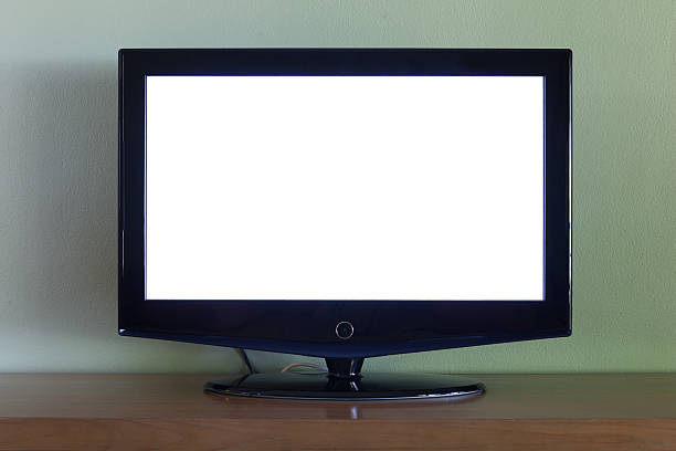 istock Black flat screen tv set on wood table 493704159
