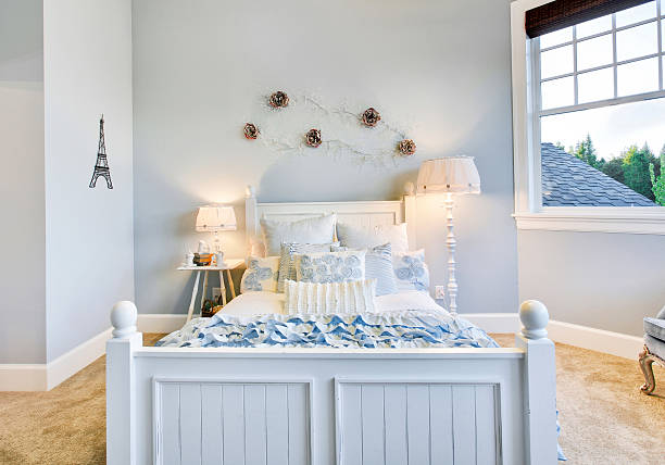 Beautifully decorated guest bedroom. (Prints on wall are mine.)