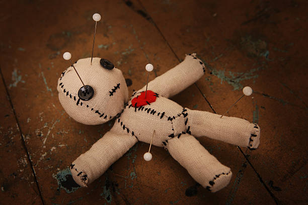 Voodoo Doll with Pins stock photo